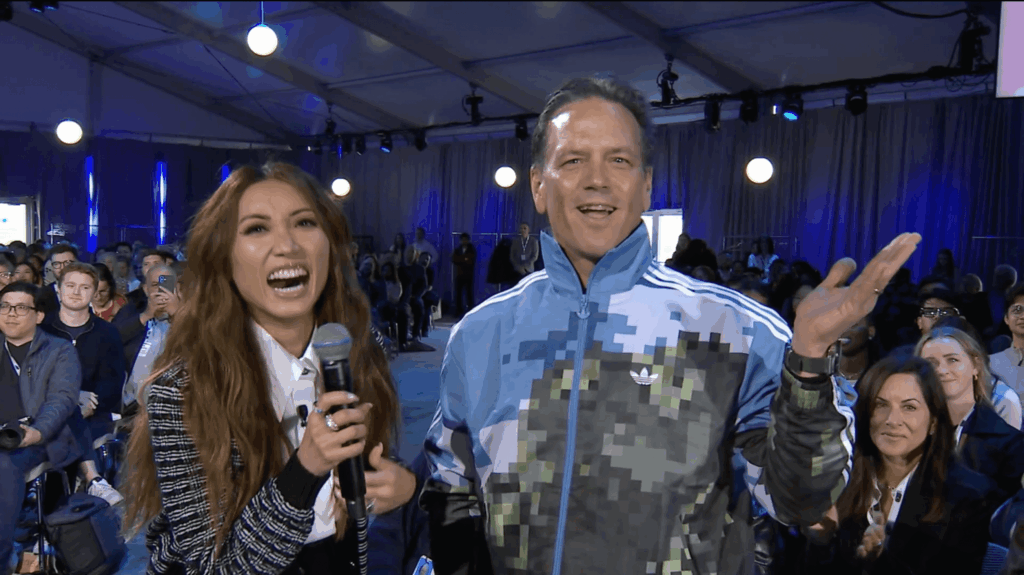 Microsoft event host, Brenda Song, engaging with an enthusiastic audience member in a candid moment during a live session.